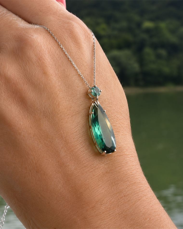 Elongated green tourmaline drop pendant on a fine chain